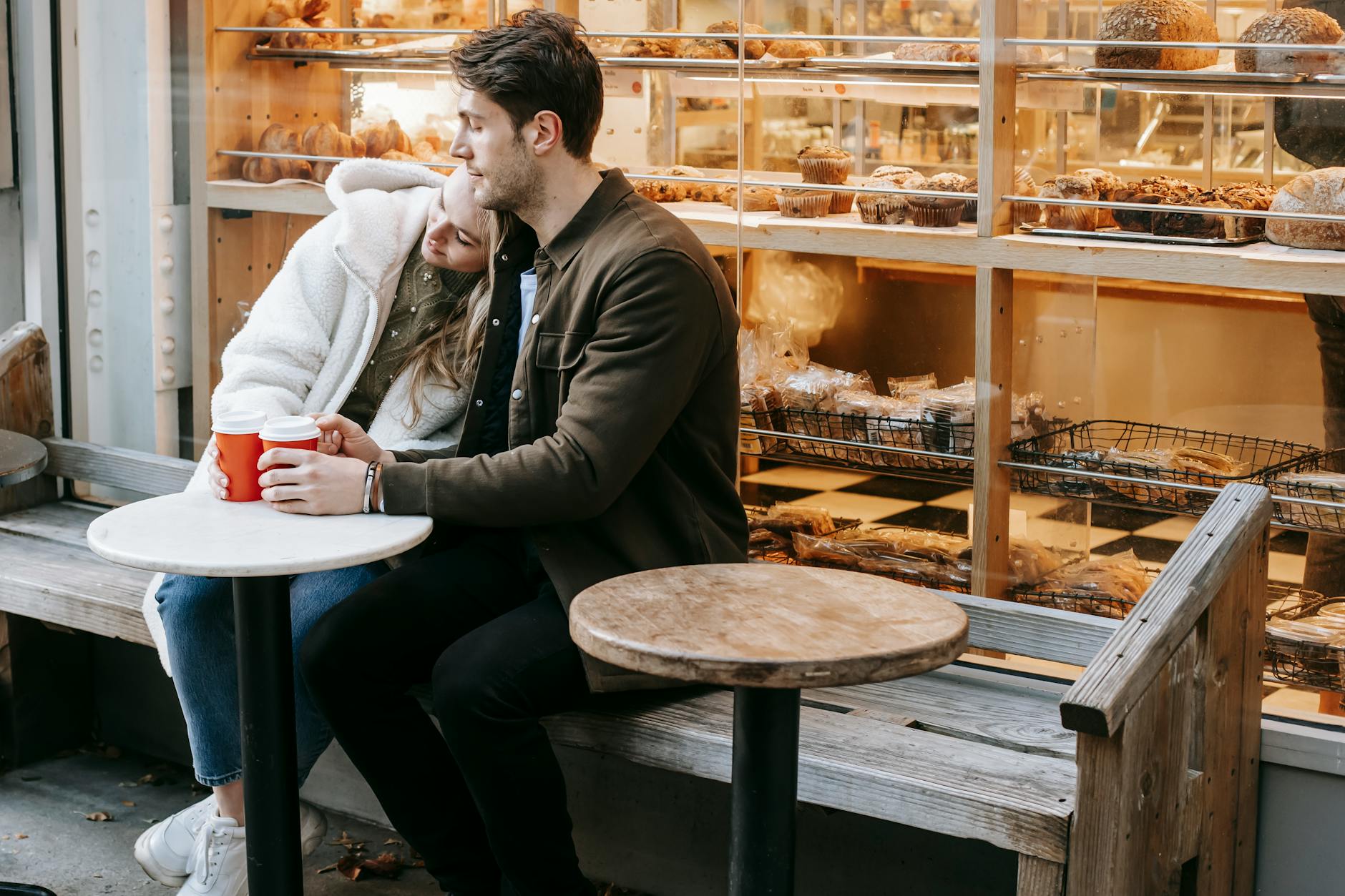 young couple having rest in small cafeteria